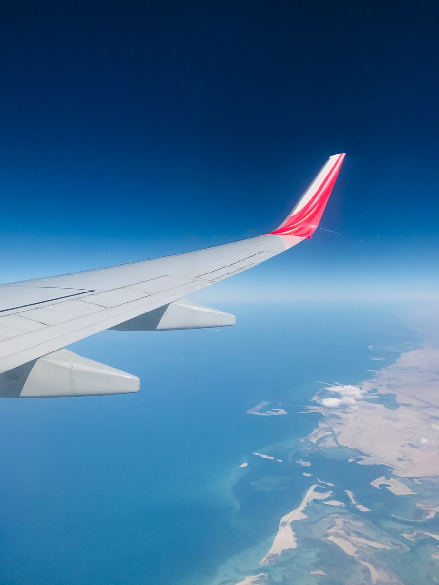 white and red airplane wing