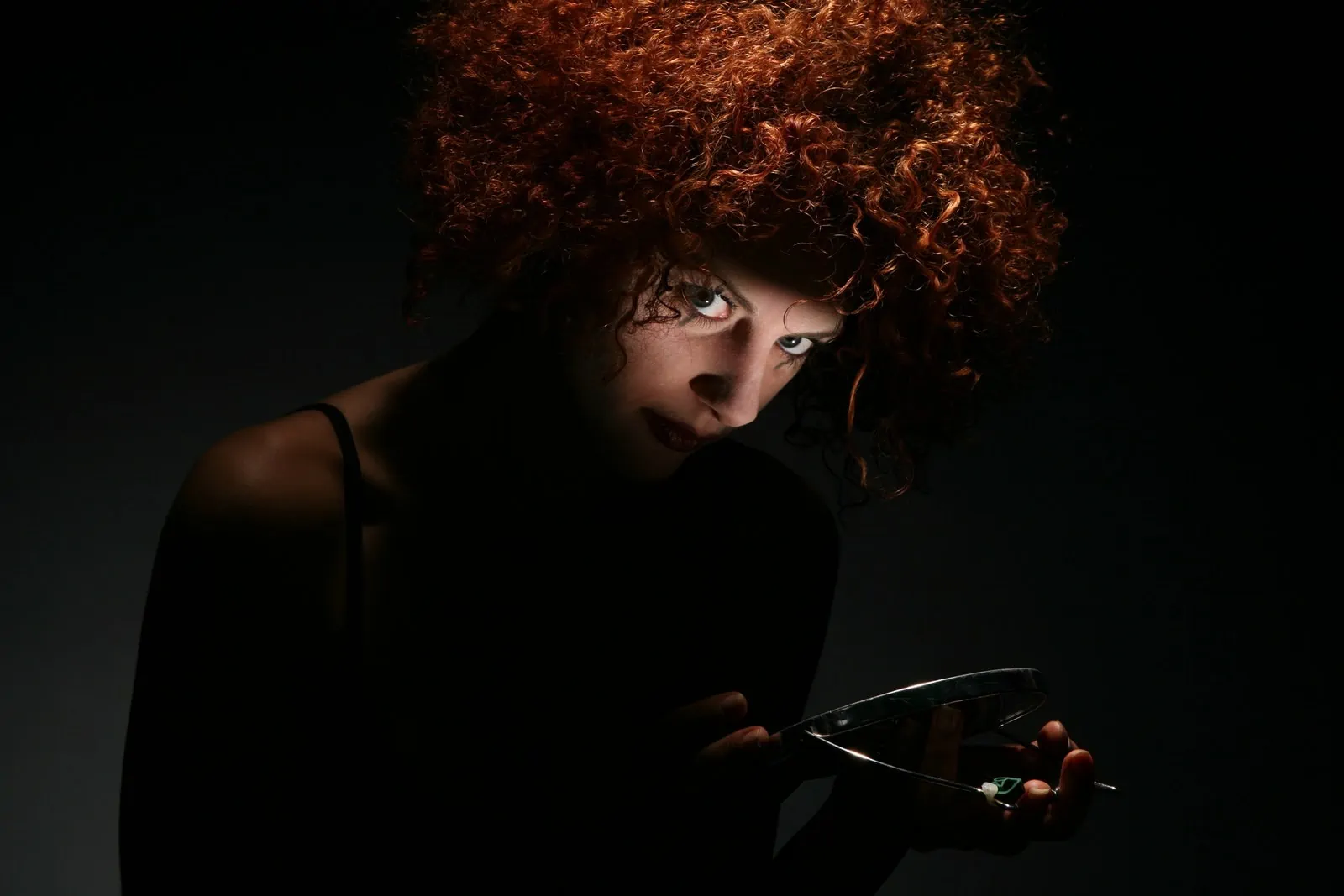 Red Haired Woman in Dark Room