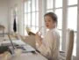 Elegant businesswoman with folder in office