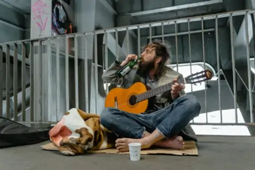 A Homeless Man Drinking