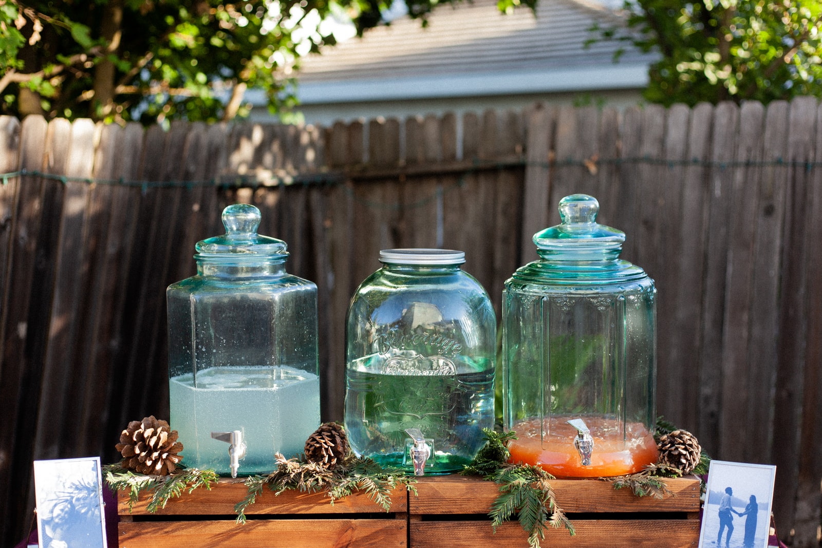 four clear glass jars on brown wooden table