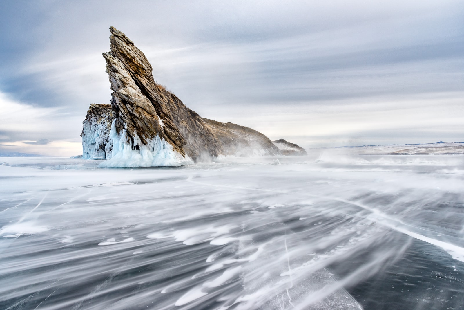 brown rock formation on white snow covered ground during daytime